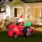 Glitzhome® 11ft. Lighted Inflatable Santa on Tractor Décor